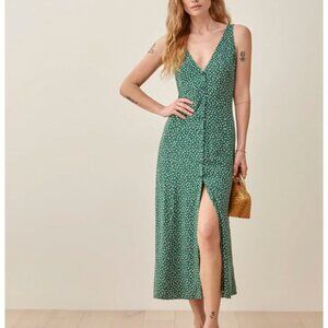 Sleeveless midi dress with a v neck. Tie in the back.